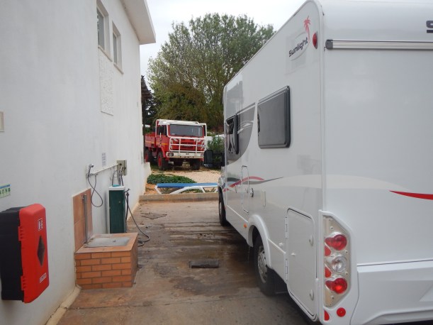 Campground "gray-water" dumping and fresh water "fill-up" station. The redish brick structure attached to the wall is for servicing your porta-potty.